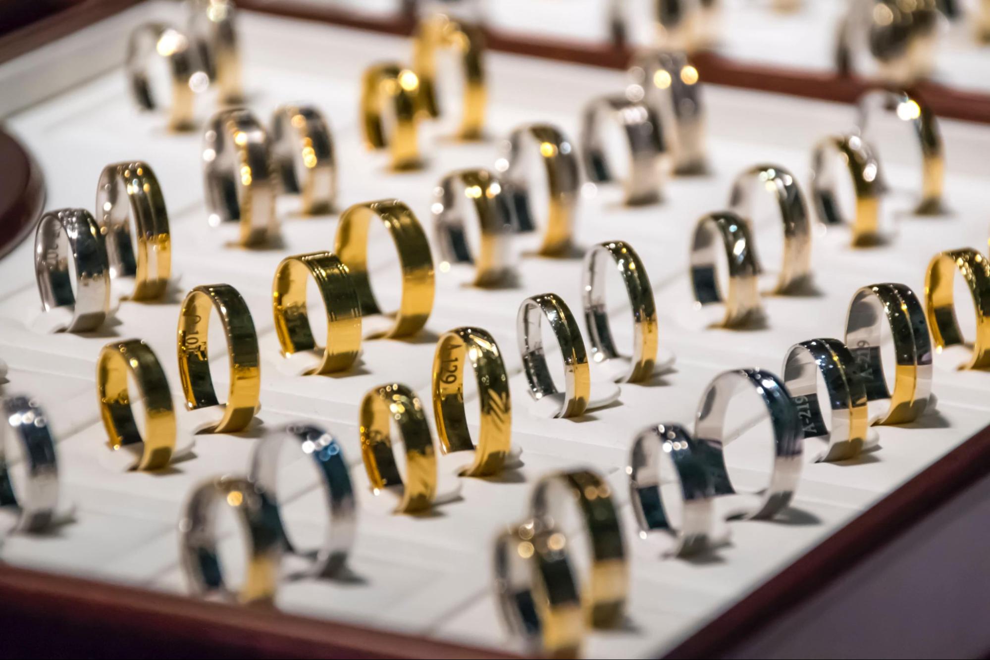 rows of wedding bands in a jewelry case
